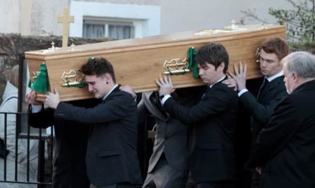 David Armstrong's coffin is carried into the church. Picture: HeMedia