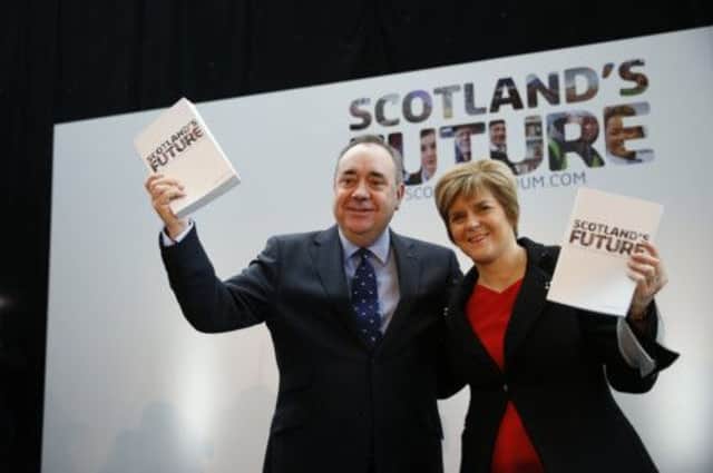 Alex Salmond and Nicola Sturgeon hold copies of the referendum white paper on independence on the day of its launch last month. Picture: Reuters