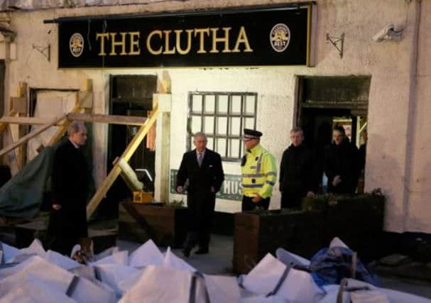 The Prince of Wales visits the scene of the police helicopter crash at the Clutha bar. Picture: PA