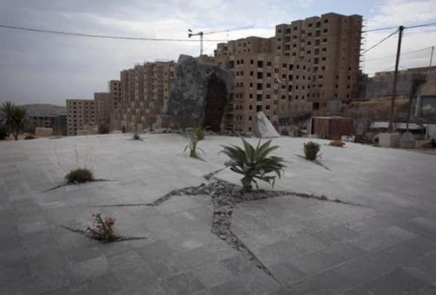 The Palestinian city of Rawabi is gradually being built by a Palestinian-American developer despite access concerns. Picture: AP