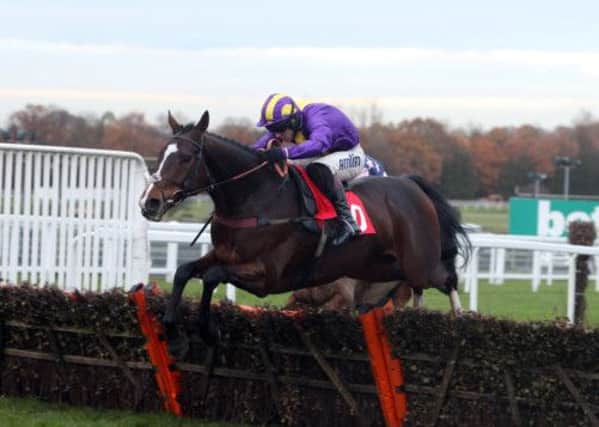 Richard Johnson rides Lord Protector to win at Sandown. Picture: PA