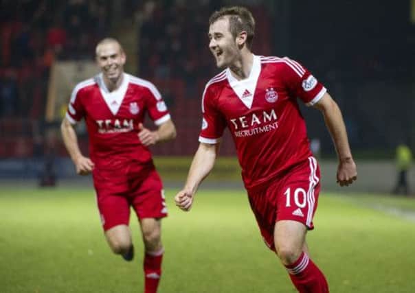 Niall McGinn celebrates after scoring Aberdeen's winner. Picture: SNS