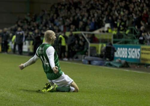 James Collins celebrates his late equaliser in front of the Hibernian support. Picture: SNS