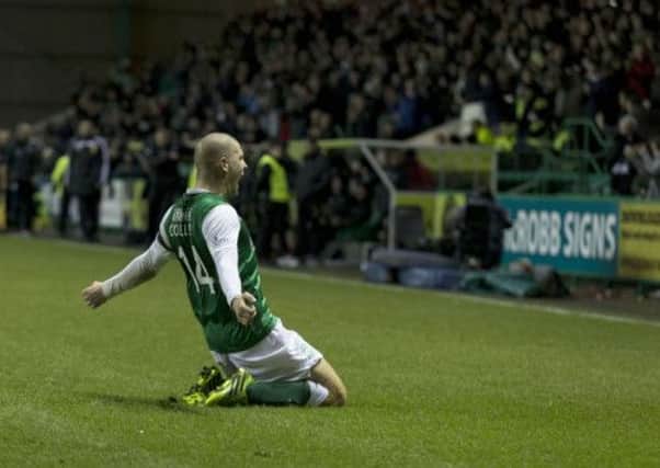 James Collins celebrates his late equaliser in front of the Hibernian support. Picture: SNS