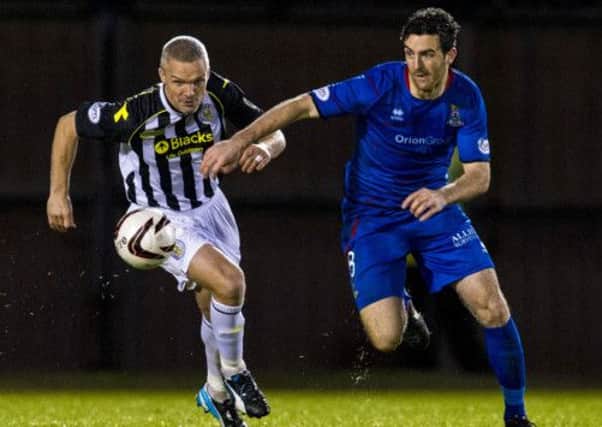 Ross Draper and St Mirren's Jim Goodwin (left) race for the ball. Picture: SNS