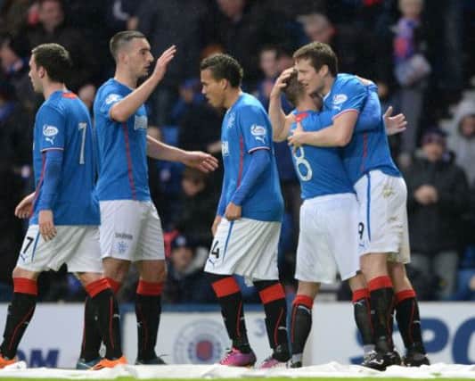 Jon Daly, far right, laps up the adulation of his team-mates after putting Rangers ahead against Ayr United. Picture: SNS