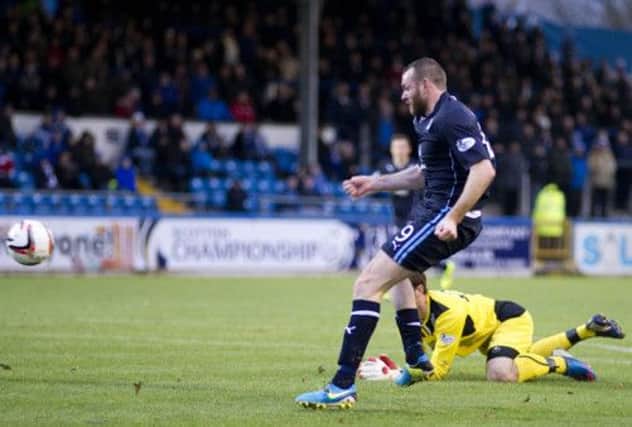 Craig Beattie fires in the shot that would be deflected in for Dundee's opener against Morton. Picture: SNS