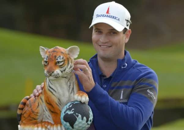 Zach Johnson with the Northwestern Mutual World Challenge trophy. Picture: AP