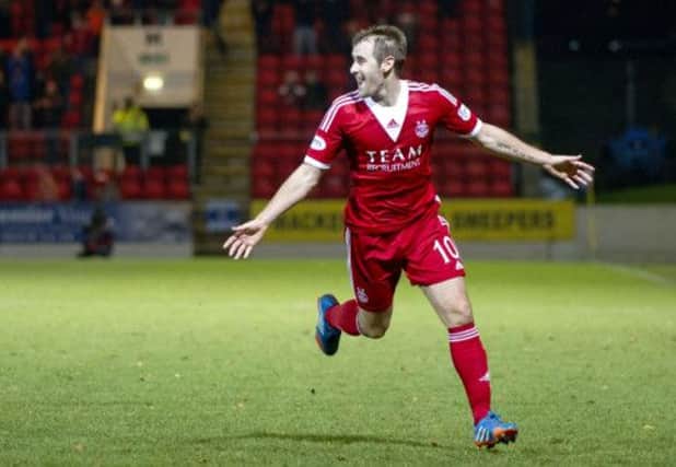 Niall McGinn celebrates after scoring for Aberdeen. Picture: SNS