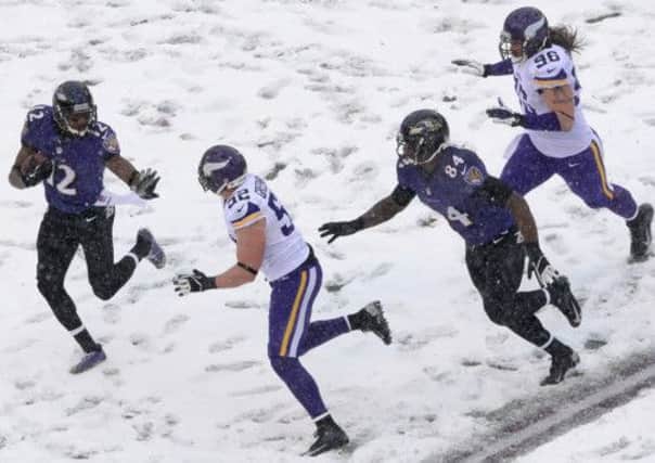 Baltimore Ravens Jacoby Jones returns a punt in the snow against the Minnesota Vikings. Picture: Getty