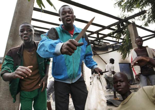 Youths loot a mosque in the Central African Republics capital Bangui yesterday. Picture: Reuters