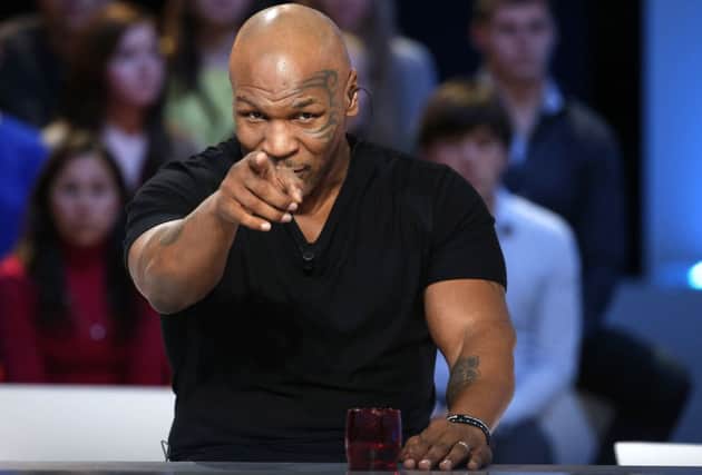 Mike Tyson moved media events to Paris, where he appeared  on TV, as he cannot enter the UK. Picture: AFP/Getty