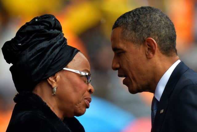Barack Obama talks with Nelson Mandela's widow Graca Machel. Picture: Getty