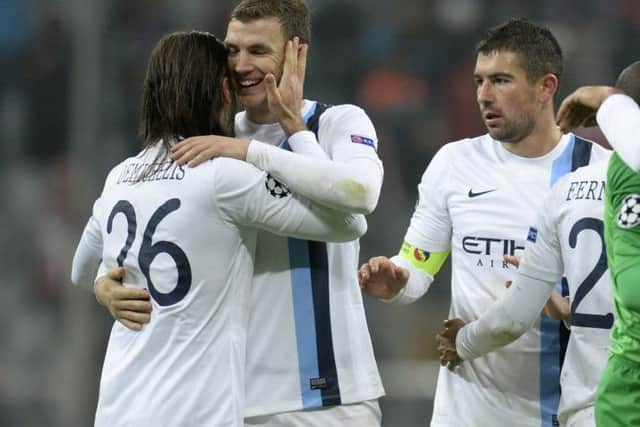 Martin Demichelis, Edin Dzeko and Alexandar Kolarov celebrate after beating Bayern Munich. Picture: Getty