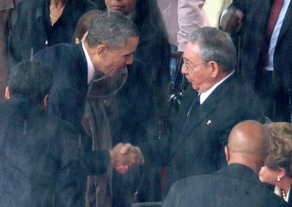 Barack Obama shakes hands with Raul Castro. Picture: Getty