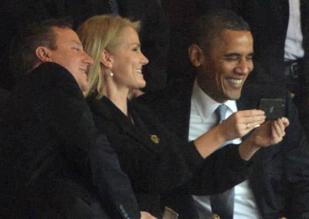 Barack Obama (R) and David Cameron pose for a picture with Danish Prime Minister Helle Thorning Schmidt. Picture: AFP