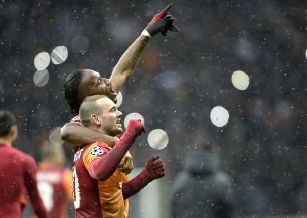 Wesley Sneijder celebrates his goal with teammate Didier Drogba against Juventus. Picture: AP