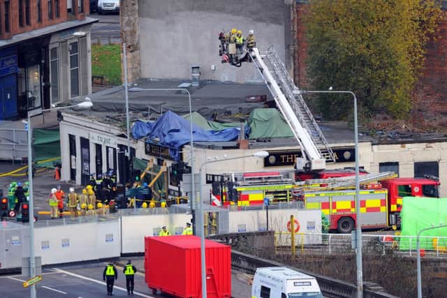 A total of 10 people died after a Police Scotland helicopter hit the Clutha bar. Picture:  Robert Perry