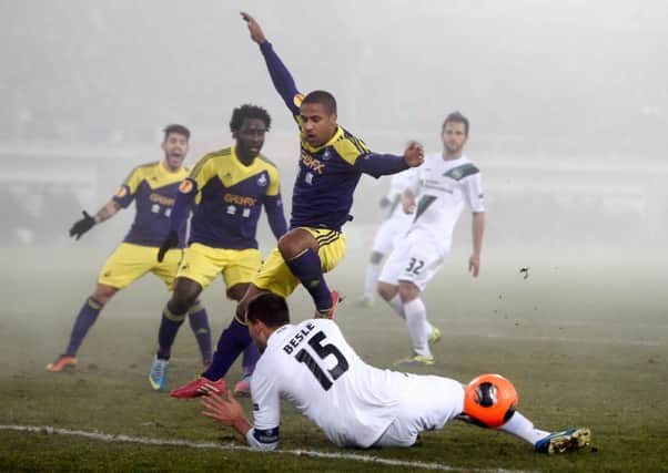 St Gallen defender Stephane Besle deflects the ball away from Swansea midfielder Wayne Routledge. Picture: Getty