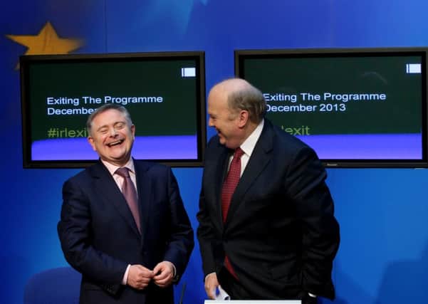 Brendan Howlin and Michael Noonan at the news conference to signal Irelands exit from the bailout. Picture: PA