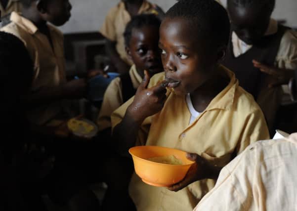 A meal break from Marys Meals at a school in Bomi County. Picture: Esme Allen