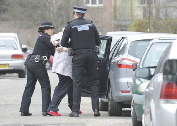 Under arrest, but officers feel pressurised into making crime targets look good. Picture: Esme Allen