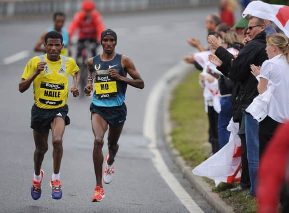 Haile Gebrselassie, left, running in the Great North Run with Mo Farah. Picture: Getty