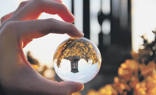 Calton Hill reflected in a glass globe. Picture: Salih Gonenc