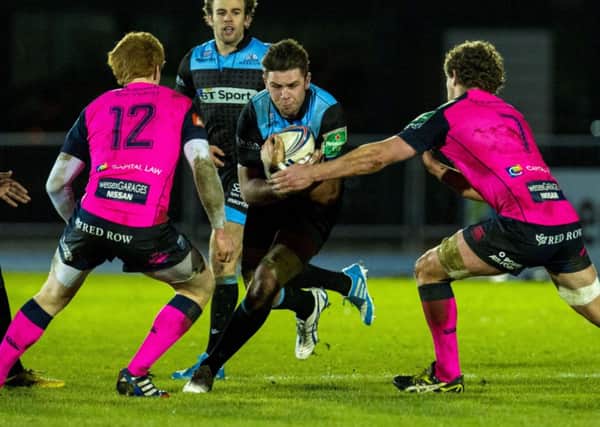 Ryan Wilson gets between Cardiff defenders Rhys Patchell and Rory Watts-Jones. Picture: SNS