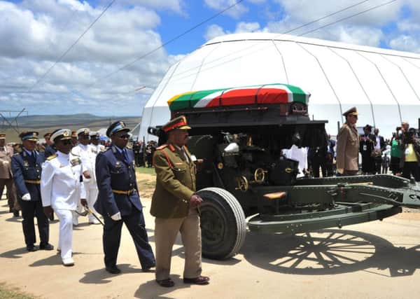 Nelson Mandela's coffin is carried on a gun carriage for a traditional burial during his funeral in Qunu. Picture: Getty