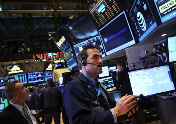 Traders work on the floor of the New York Stock Exchange. Picture: Getty