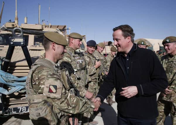 David Cameron talks with British soldiers at Camp Bastion in Helmand province, Afghanistan.