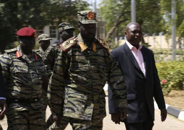 President Salva Kiir, centre, wore fatigues to address the nation yesterday. Picture: Reuters