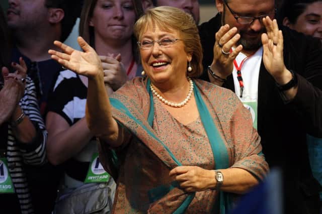 Michelle Bachelet waves during a victory rally in Santiago on Sunday. Picture: AP