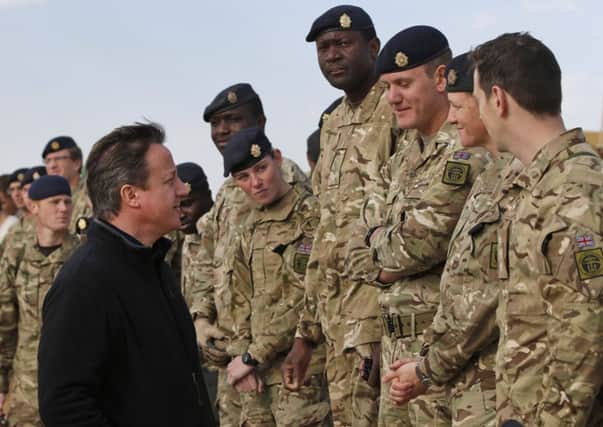 David Cameron talks to British soldiers during a visit to Camp Bastion. Picture: Getty
