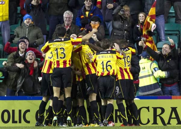 Partick Thistle have offered refunds to fans who bought a calendar featuring photos of the wrong fans. Picture: SNS