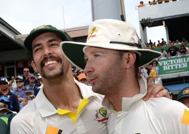 Australia's Mitchell Johnson (left) celebrates with Michael Clarke (right) after their Test win against England. Picture: PA