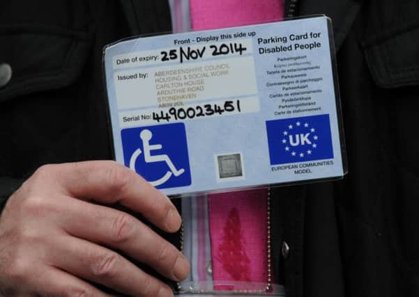 Tougher laws enforcing correct usage of blue badges for disabled motorists will be proposed in parliament today. Picture: TSPL