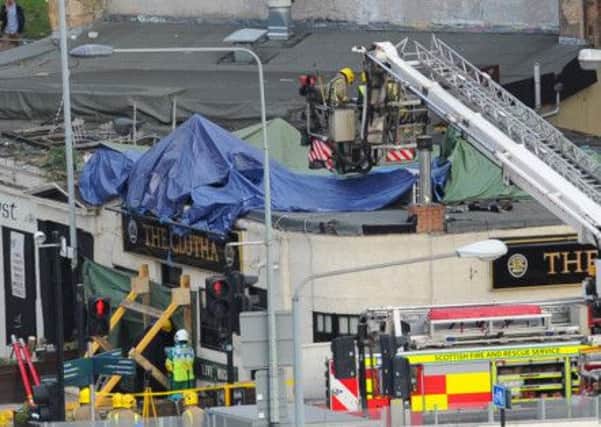 Four teenagers accused of breaking into the Clutha helicopter crash site and stealing money and alcohol have been remanded in custody. Picture: Robert Perry