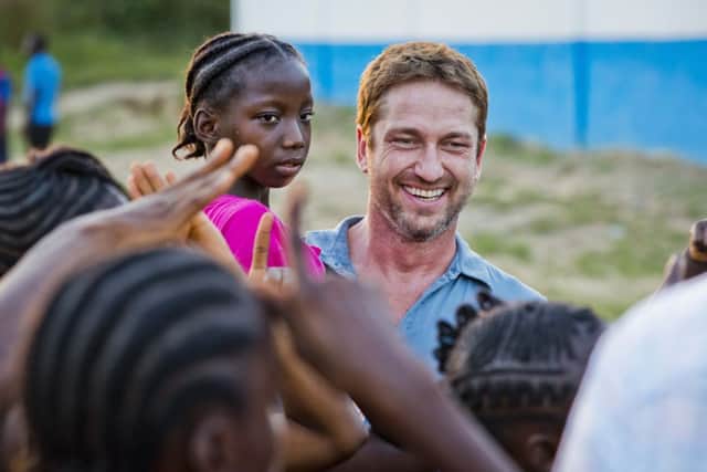 Gerard Butler in Liberia as part of a visit to Marys Meals projects. Picture: Chris Watt
