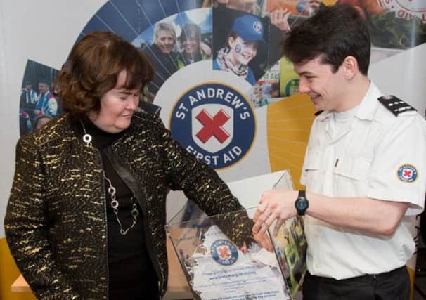 Susan Boyle draws the St Andrew's First Aid raffle. Picture: Contributed