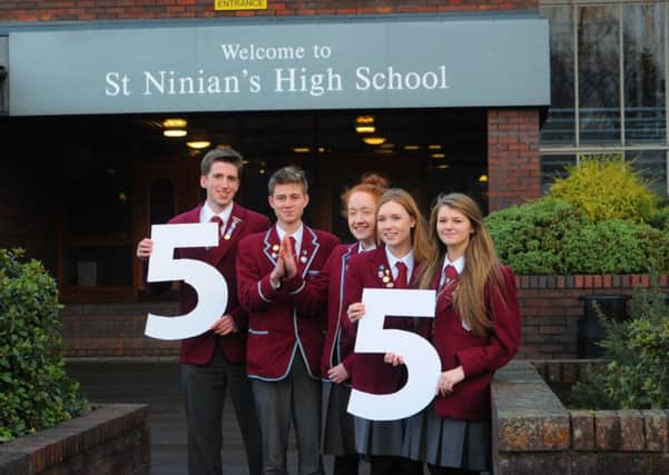 St Ninians S5 pupils celebrate their table-topping achievement. Picture: Robert Perry