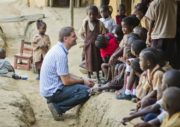 Magnus MacFarlane-Barrow speaks to pupils at St Raphaels school in Liberia  the Marys Meals founder had to make his way there by canoe. Picture: Chris Watt
