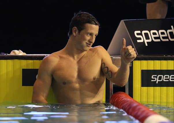 Michael Jamieson, top, gives a thumbs-up after winning the 200 metres breaststroke at the Duel in the Pool yesterday. Picture: Getty