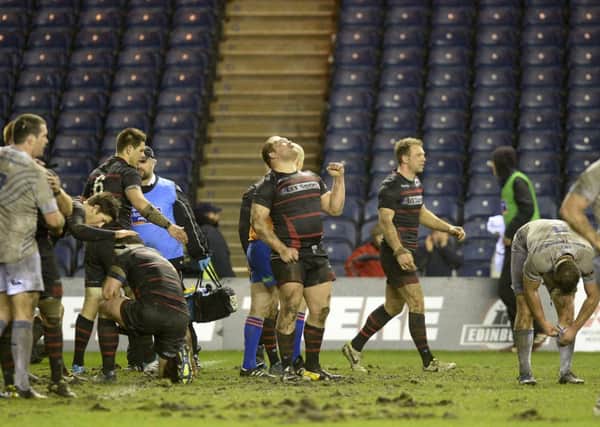 Willem Nel (centre) looks to the skies after Edinburgh record a well earned victory. Picture: SNS