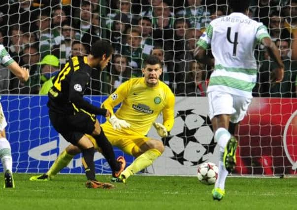 Fraser Forster dives to save from Neymar in this season's Champions League. Picture: Robert Perry