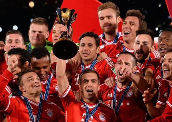 Bayern Munich captain Philipp Lahm raises the trophy aloft. Picture: Getty