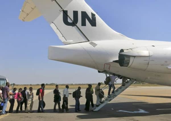 United Nations personnel join British, American, Canadian and Kenyan nationals on airlifts to safety. Picture: Irene Scott/AP