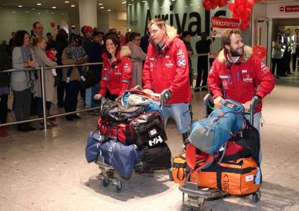 Kate Philip, Duncan Slater and Guy Disney arrive back at Terminal 3 of Heathrow Airport. Picture: PA