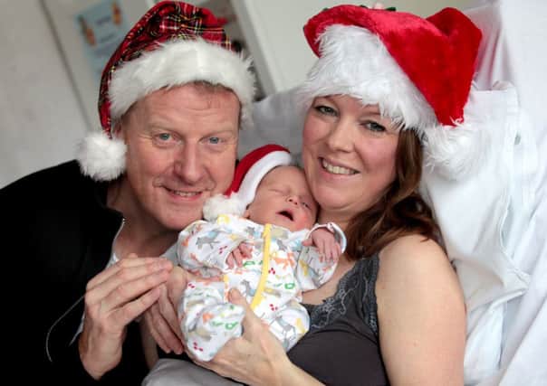 Parents Lesley Alexander, 44 and Ian Cumming, 51 hold their son, Ruaridh in St John's Hospital, Livingston. Picture: Hemedia